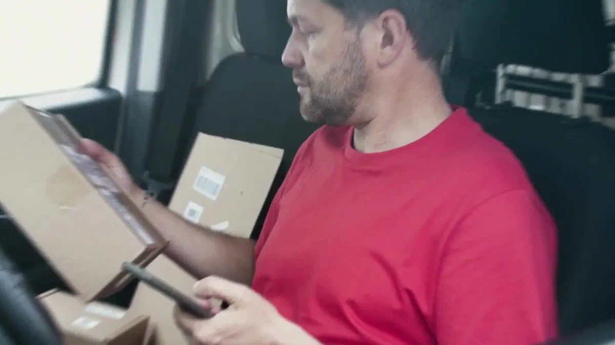 Courier checking a delivery address